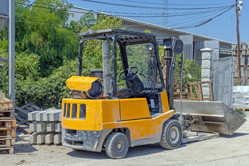 Forklift with Bucket stock photo. Image of equipment 227805582