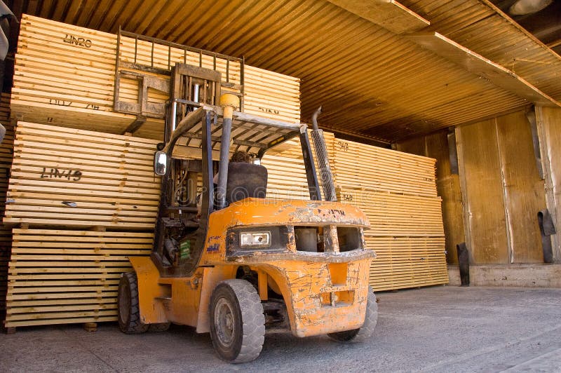 Forklift loading timber drying kilns. Forklift loading timber drying kilns