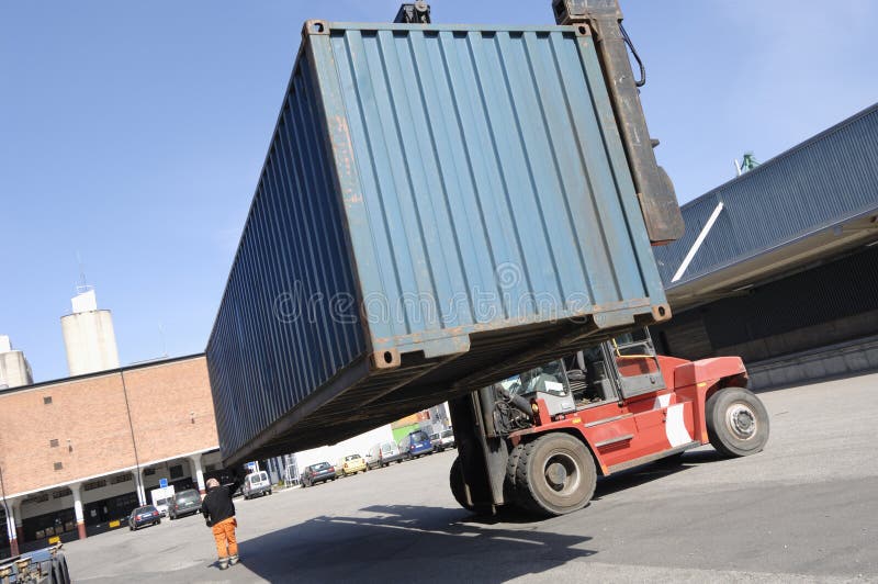 Forklift lifting container stock image. Image of bluecollar - 2411931