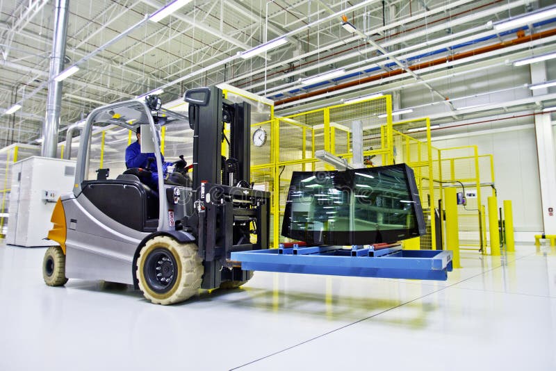 Forklift loader in large modern warehouse