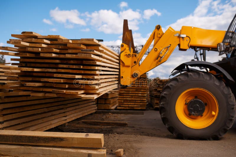 Forklift Loads The Boards In The Lumber Yard Stock Image - Image of