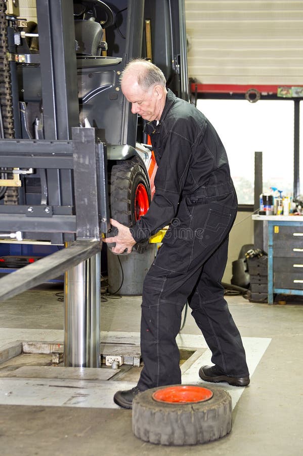 Man Operating Forklift Truck In Warehouse Stock Photo Image of side