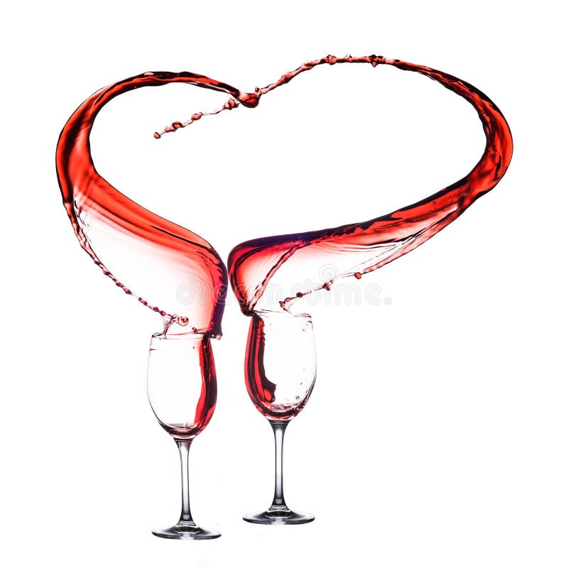 Forma del cuore del vino rosso fotografie stock Forma del cuore del vino rosso fotografie stock