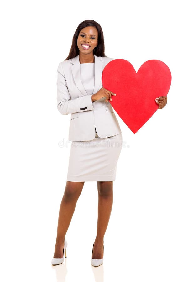 Forma del cuore della tenuta della donna fotografie stock Forma del cuore della tenuta della donna fotografie stock