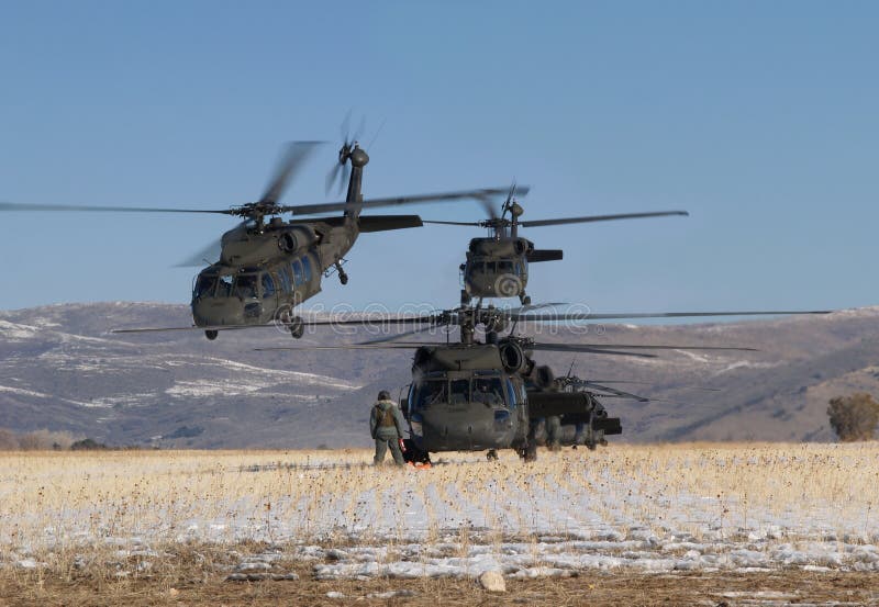 Blackhawk helicopter formation preparing to takeoff. Blackhawk helicopter formation preparing to takeoff.