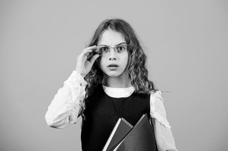 Formal education and homeschooling. Check knowledge. Final exam coming. Girl hold textbook folder test. School exam stock photography