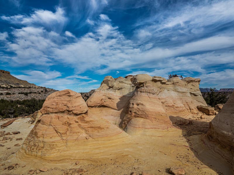 Colorfully Banded Cretateous Sandstone Formations Under A Cloudy Sky, Ojito Wilderness, Sandoval County, New Mexico. Colorfully Banded Cretateous Sandstone Formations Under A Cloudy Sky, Ojito Wilderness, Sandoval County, New Mexico