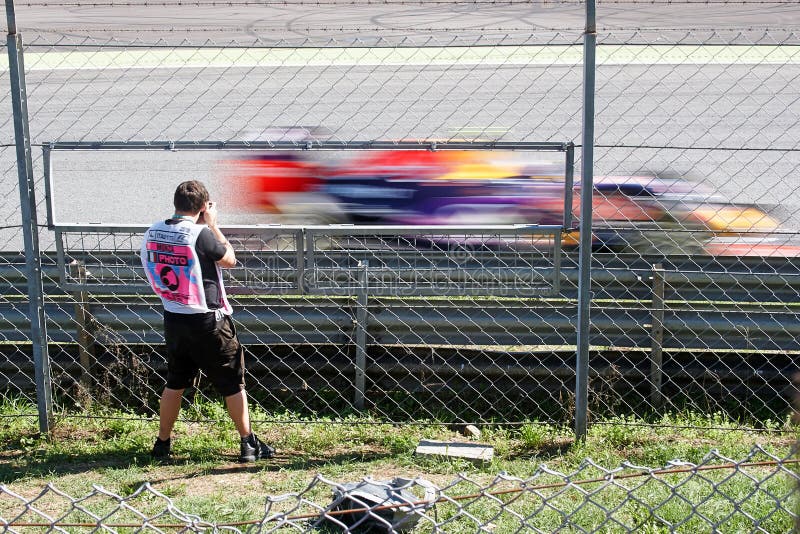 Monza, Italia - September 06: Photographer in aciton - photographing a car, Scuderia Toro Rosso. Autodromo Nazionale Monza: 04.-06.09.2015 - FORMULA 1 GRAN PREMIO D'ITALIA 2015, Monza
