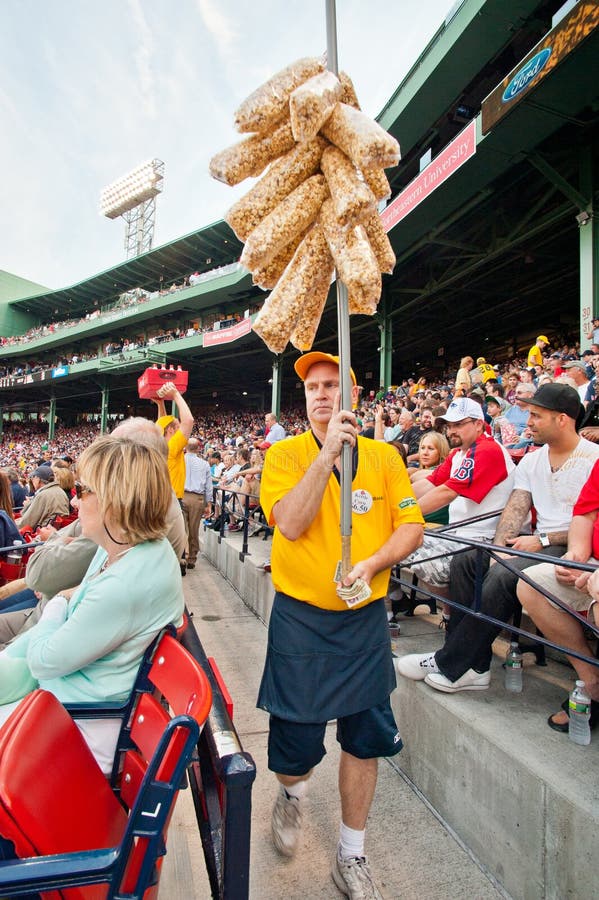 Boston- June 19: Vendor selling popcorn at historic Fenway Park, home of the Red Sox on June 19, 2012 in Boston, Massachusetts. Boston- June 19: Vendor selling popcorn at historic Fenway Park, home of the Red Sox on June 19, 2012 in Boston, Massachusetts.