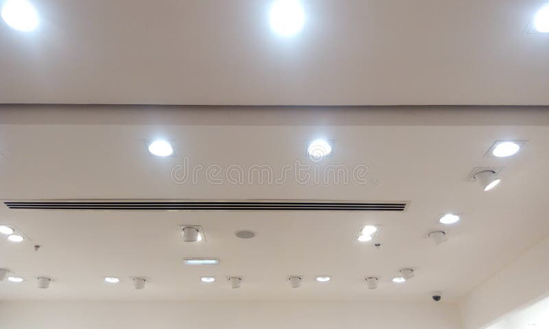 Gypsum false ceiling and coves painted with with emulsion paint and lighting fixtures for an retail shop interior decoration in an shopping mall. Gypsum false ceiling and coves painted with with emulsion paint and lighting fixtures for an retail shop interior decoration in an shopping mall