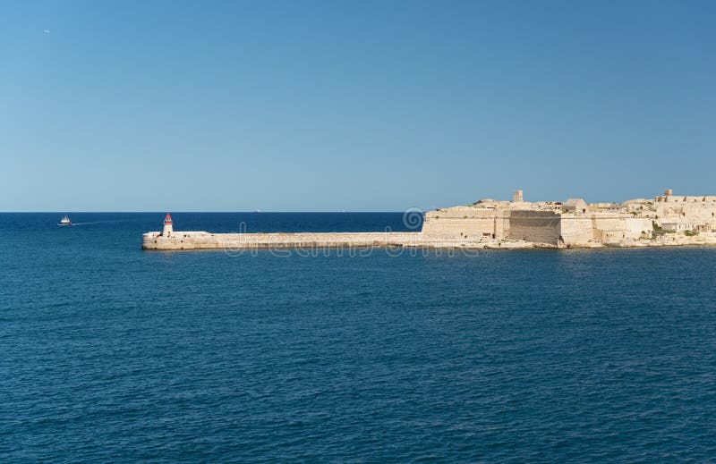 Fort Ricasoli and a Lighthouse in Malta Stock Photo - Image of ...