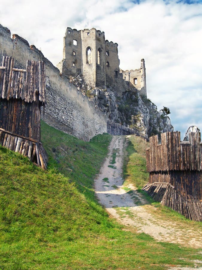 Fortification and chappel of The Castle of Beckov. Summer view of ruined castle of Beckov with massive fortification and ruined chappel in background. The Castle stock photography Fortification and chappel of The Castle of Beckov. Summer view of ruined castle of Beckov with massive fortification and ruined chappel in background. The Castle stock photography