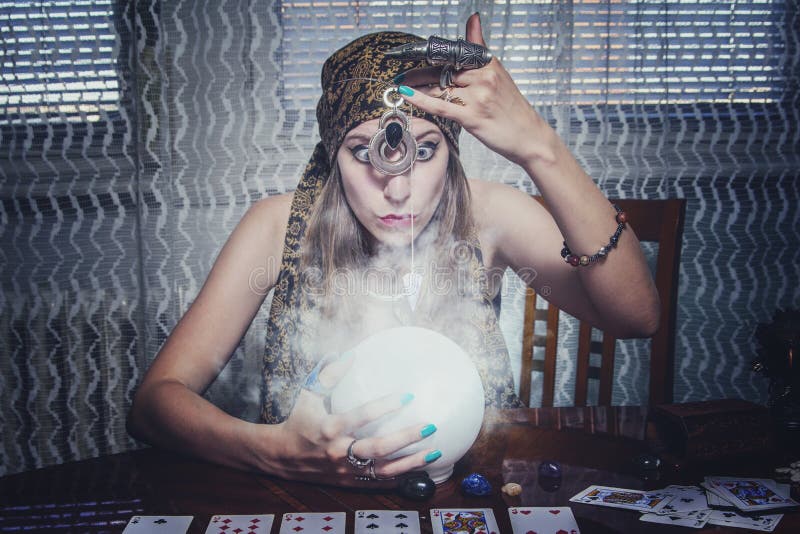 Fortune teller gazing in a crystal ball