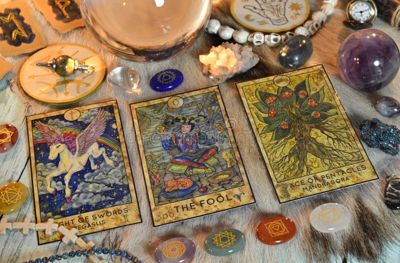 Fortune telling ritual with chakras on stones, tarot cards and runes on witch table. Esoteric, gothic and occult background, Halloween mystic concept