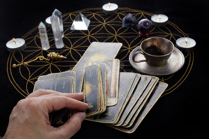 Fortune Telling Table with Tarot Cards and Esoteric Objects. Fortune