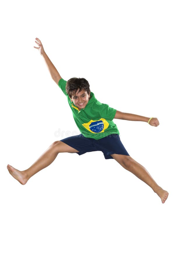 Fotbalist care sare în steagul brazilian. royalty free stock images