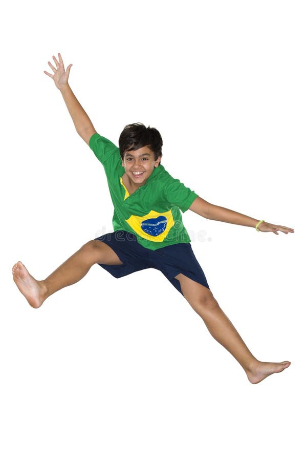 Fotbalist care sare în steagul brazilian. stock image