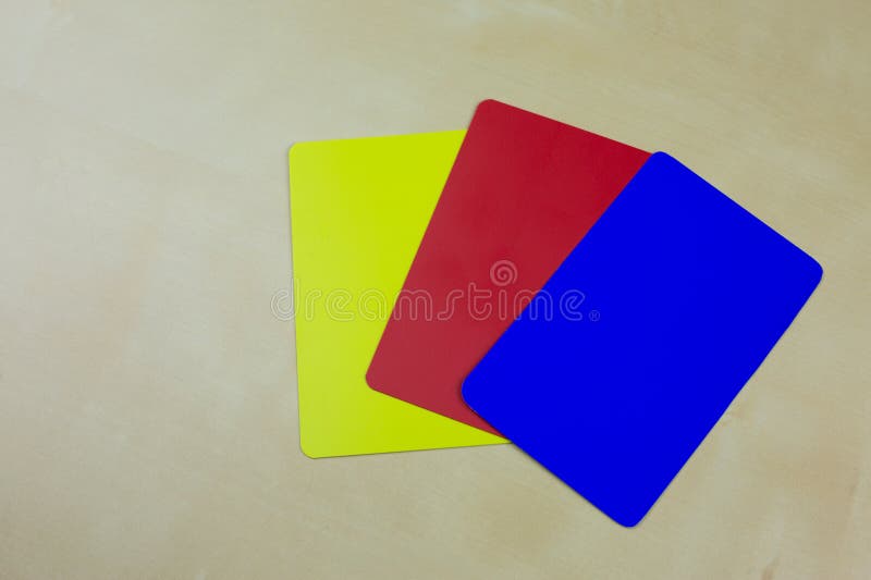 Football referee cards, new blue card for sending off a player for 10 minutes, changes in football rules. Football referee cards, new blue card for sending off a player for 10 minutes, changes in football rules