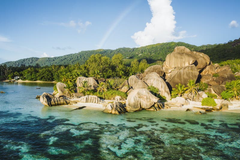 Aerial photo of amazing granite Rocks on beautiful paradise tropical beach Anse Source D Argent at La Digue island, Seychelles. Summer vacation, travel and lifestyle concept. Aerial photo of amazing granite Rocks on beautiful paradise tropical beach Anse Source D Argent at La Digue island, Seychelles. Summer vacation, travel and lifestyle concept.