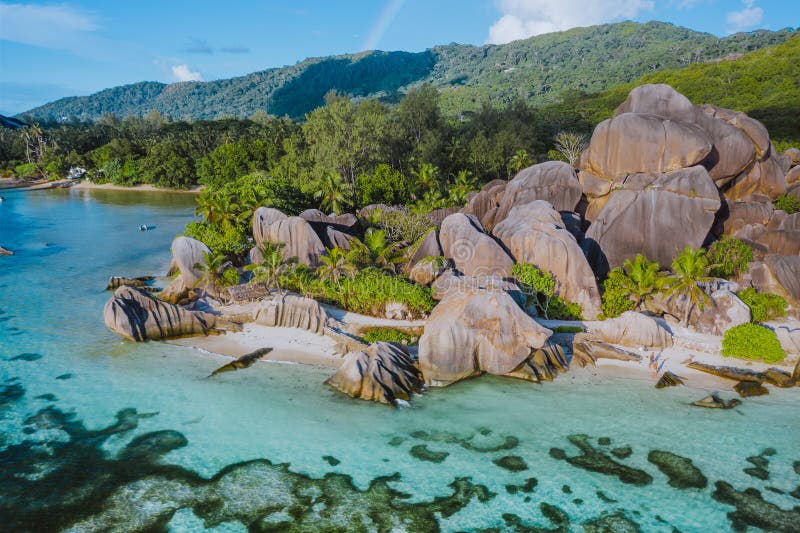 Aerial photo of amazing granite Rocks on beautiful paradise tropical beach Anse Source D Argent at La Digue island, Seychelles. Summer vacation, travel and lifestyle concept. Aerial photo of amazing granite Rocks on beautiful paradise tropical beach Anse Source D Argent at La Digue island, Seychelles. Summer vacation, travel and lifestyle concept.