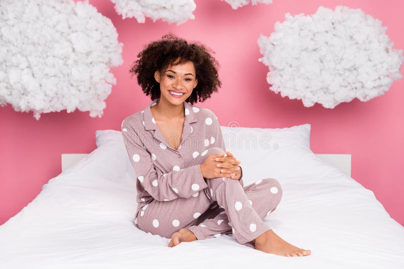 Photo of adorable charming lady wear pajama relaxing soft bed fluffy clouds isolated pink color background. Photo of adorable charming lady wear pajama relaxing soft bed fluffy clouds isolated pink color background.