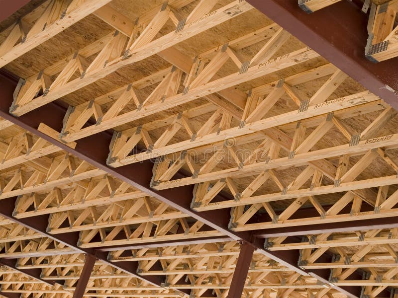 Stock photo of the wood frames of the second floor of a new urban housing development under construction. Stock photo of the wood frames of the second floor of a new urban housing development under construction.