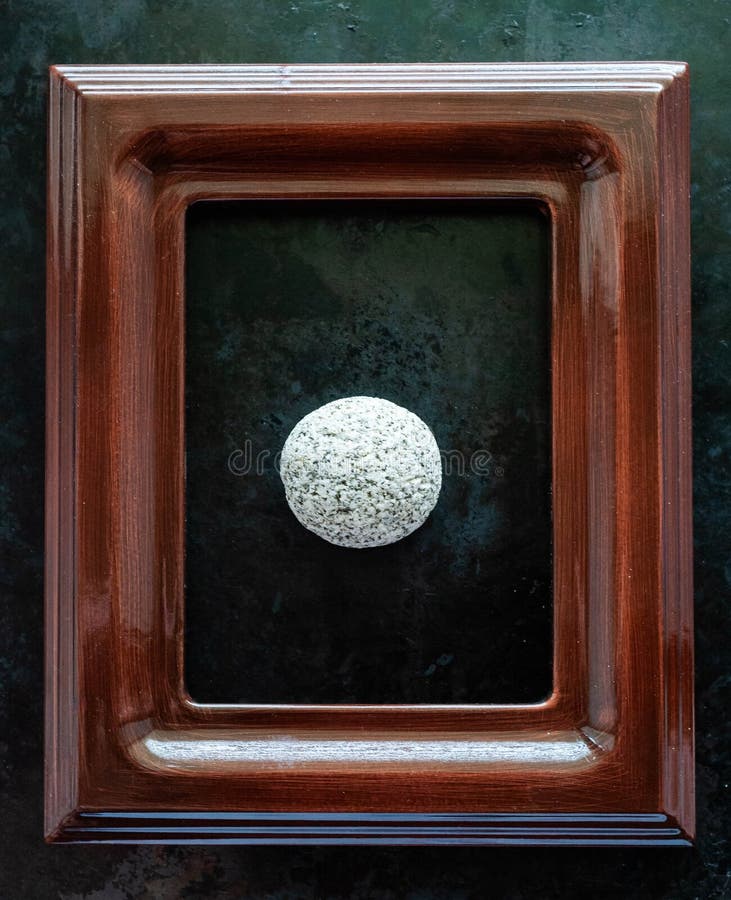 River stone of white color in a frame from a picture. the concept of certainty, stability, inviolability, immutability, fortress. River stone of white color in a frame from a picture. the concept of certainty, stability, inviolability, immutability, fortress.