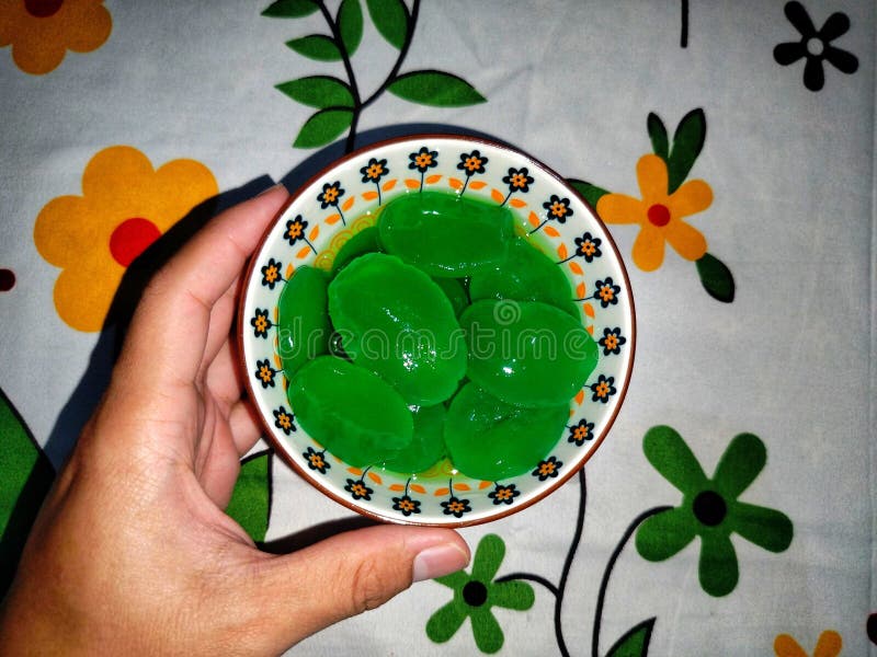 photo of green palm fruit in a beautiful bowl. photo of green palm fruit in a beautiful bowl