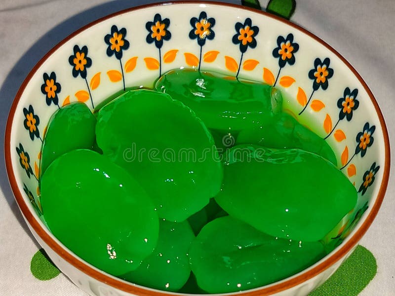photo of green palm fruit in a beautiful bowl. photo of green palm fruit in a beautiful bowl
