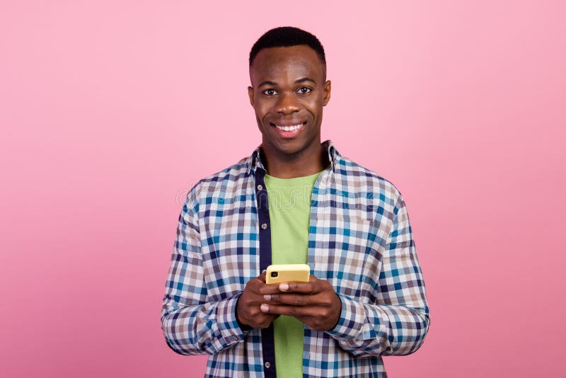 Photo of handsome businessman influencer blogger using cellphone to order taxi in uber black service isolated on pink color background. Photo of handsome businessman influencer blogger using cellphone to order taxi in uber black service isolated on pink color background.