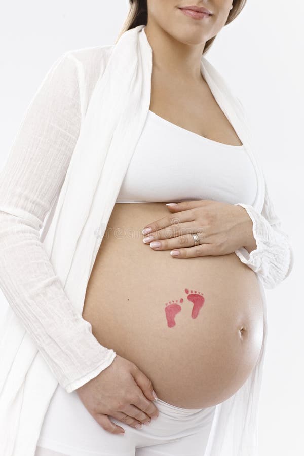 Foto do close up da barriga grávida fotografia de stock