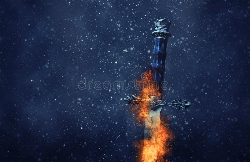 mysterious and magical photo of silver sword with fire flames over gothic snowy black background. Medieval period concept. mysterious and magical photo of silver sword with fire flames over gothic snowy black background. Medieval period concept