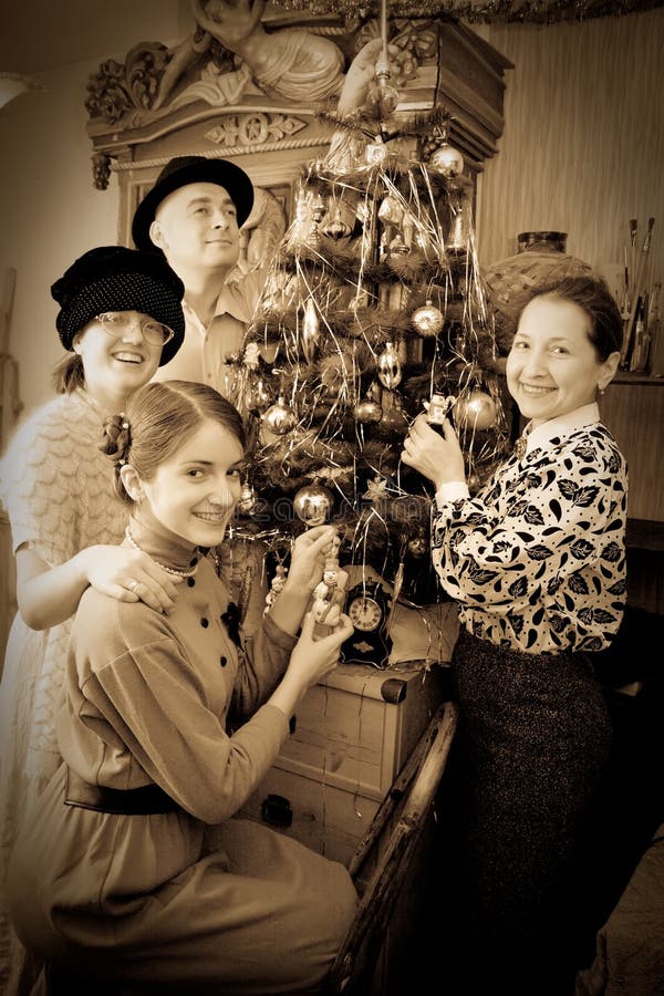 Retro photo of Family decorating Christmas tree at home. Retro photo of Family decorating Christmas tree at home