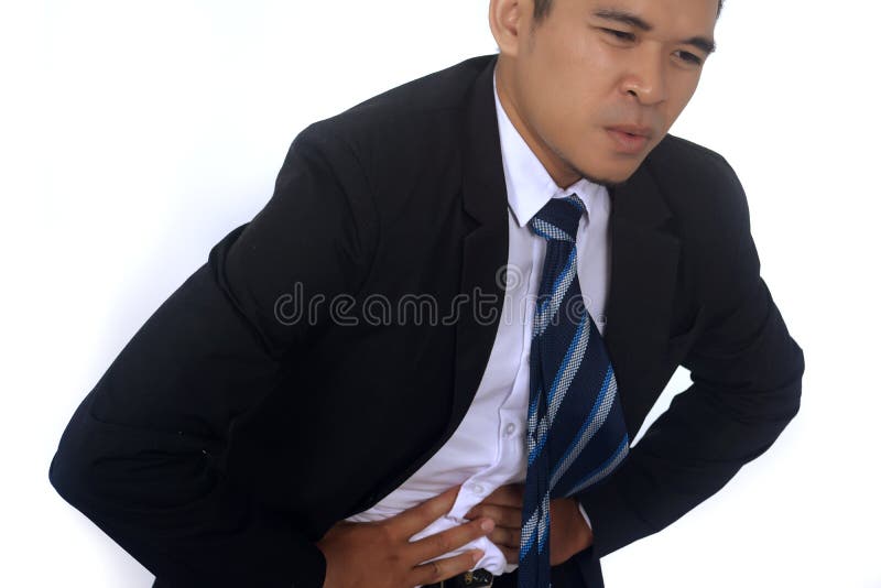 Fotobild eines hübschen asiatischen Geschäftsmannes, der unter Bauchschmerzen leidet lizenzfreies stockbild Fotobild eines hübschen asiatischen Geschäftsmannes, der unter Bauchschmerzen leidet lizenzfreies stockbild
