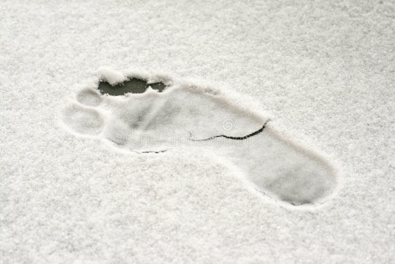 Footprint on fresh snow - mark of naked foot. Footprint on fresh snow - mark of naked foot