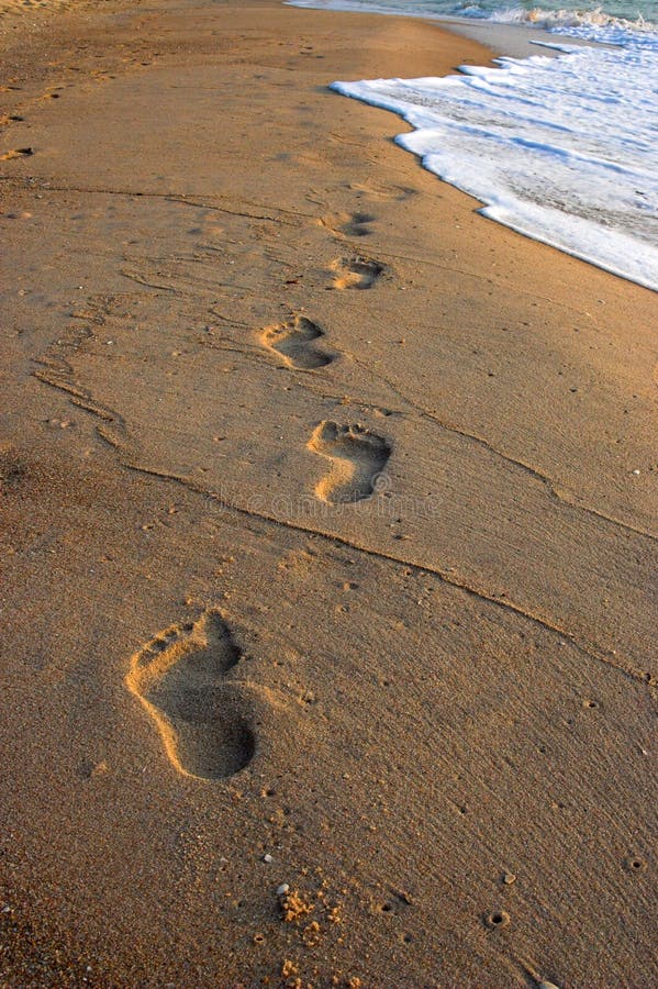 Footprints in the sand, at sunrise. Footprints in the sand, at sunrise