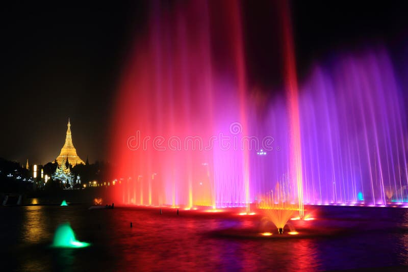 fountain with colorful illuminations at night near the Shwedagon Pagoda