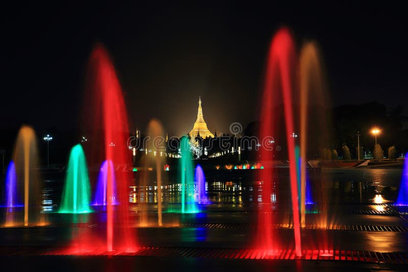 fountain with colorful illuminations at night near the Shwedagon Pagoda