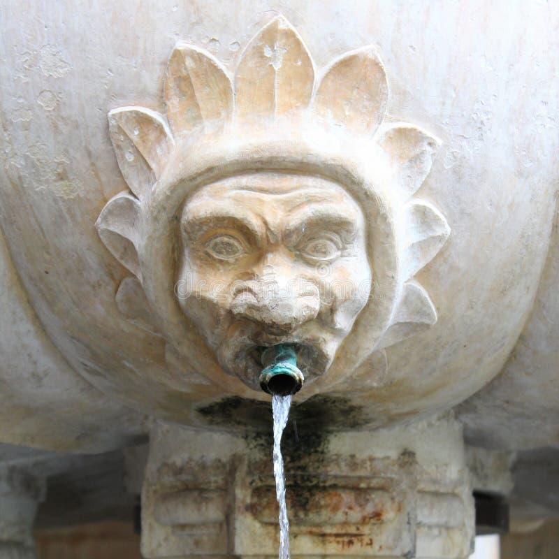 Water fountain stone head face