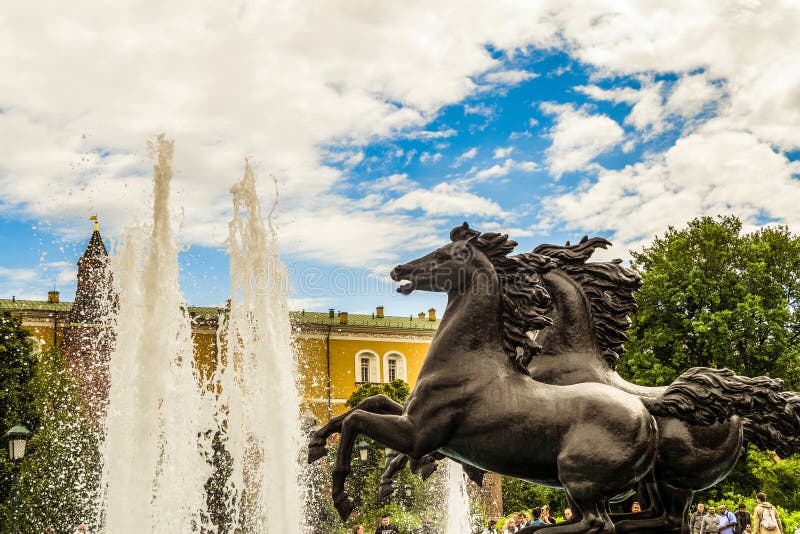 Fountain `Four Seasons`, located on the Manege Square. Statues of four frolicking horses. Moscow city center. stock image Fountain `Four Seasons`, located on the Manege Square. Statues of four frolicking horses. Moscow city center. stock image