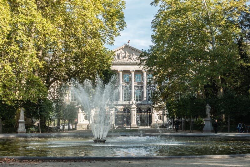 Fountain at Park of Brussels hides Parliament, Brussels Belgium. royalty free stock photography Fountain at Park of Brussels hides Parliament, Brussels Belgium. royalty free stock photography