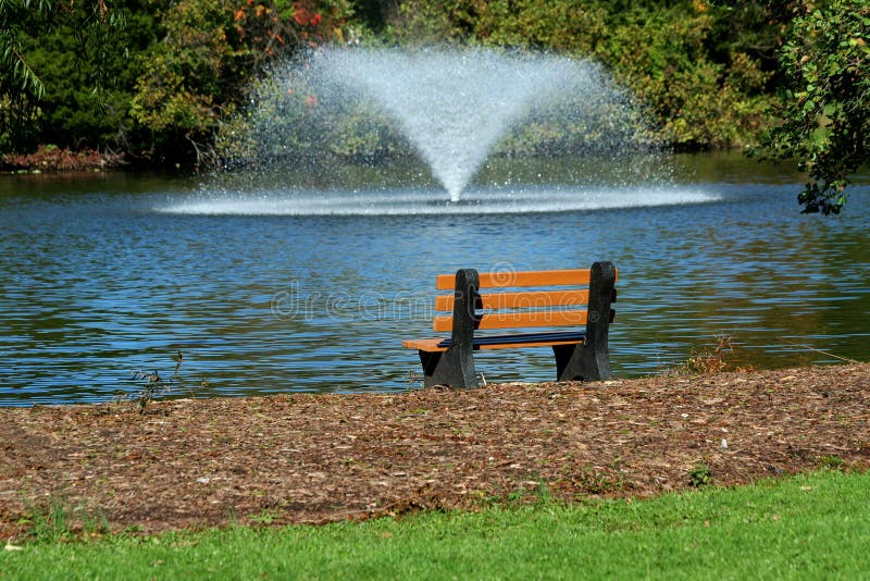 Fountain on a Pond with Park Bench Stock Photo Image of water, beauty