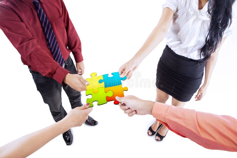 Business team building puzzle stock photos Business team building puzzle stock photos