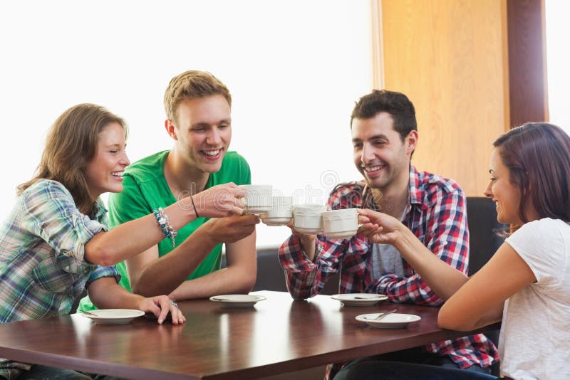 Four Casual Students Drinking a Cup of Coffee Stock Image - Image of ...