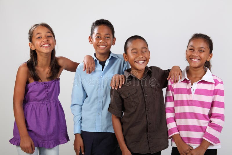 Four cheerful school friends share happy laughter