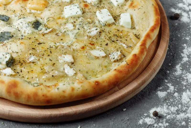 Four Cheese Pizza, Italian Pizza. Pizza Stuffed with Four Varieties of