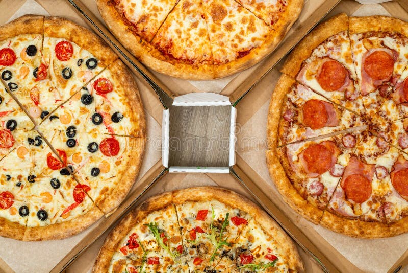 Four Different Cut Pizzas are in Square Boxes. Meat and Vegetarian