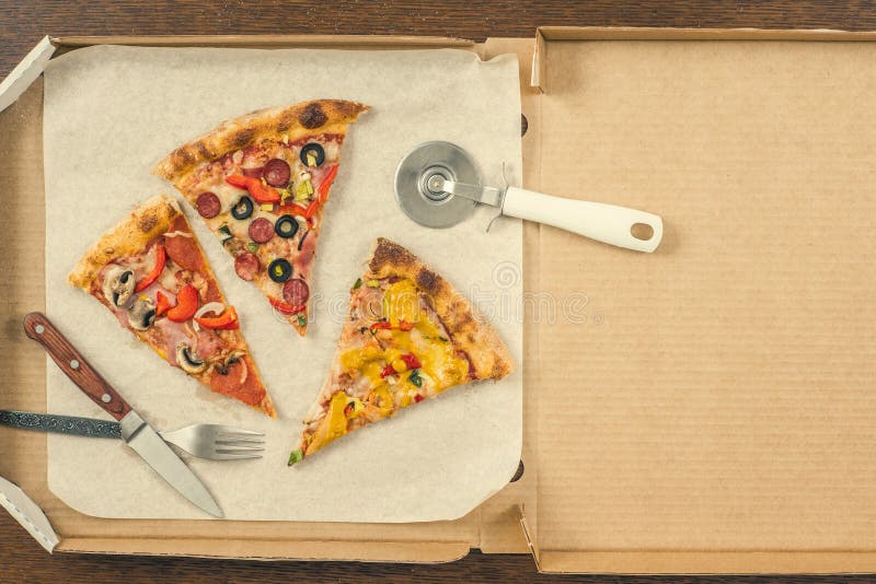 Four Different Pieces of Pizza in the Open Delivery Box. Space for Text