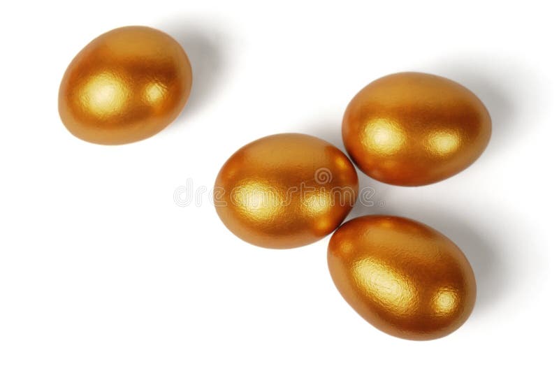 Four Easter bright golden eggs on a white background