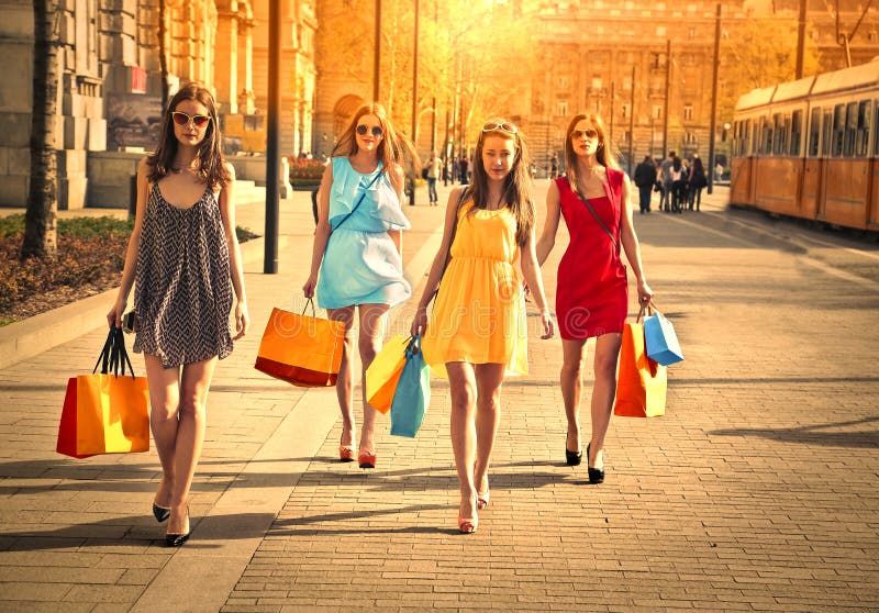 Four friends doing shopping stock photography